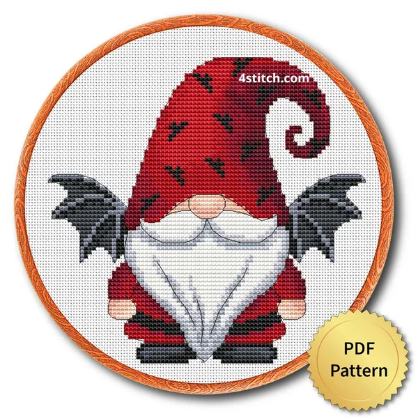 Bat Wing Halloween Gnome displayed on white Aida in a wooden embroidery hoop with a PDF pattern badge