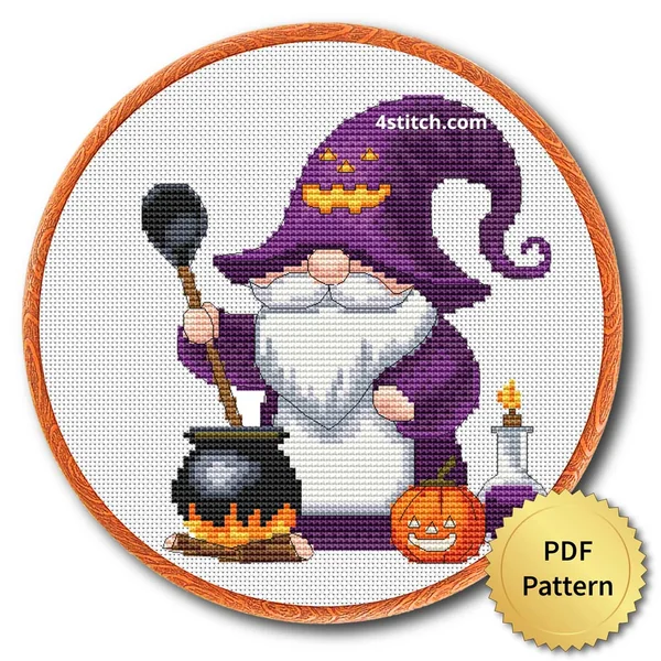 Cauldron Witch Gnome displayed on white Aida in a wooden embroidery hoop with a PDF pattern badge