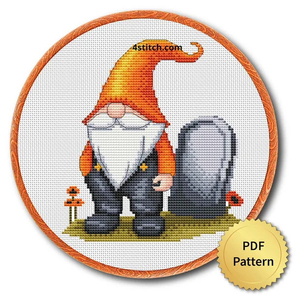 Orange Hat Graveyard Gnome displayed on white Aida in a wooden embroidery hoop with a PDF pattern badge