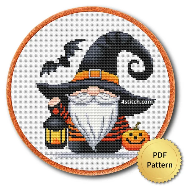 Pumpkin Lantern Gnome displayed on white Aida in a wooden embroidery hoop with a PDF pattern badge
