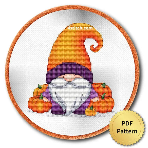 Pumpkin Patch Orange Hat Gnome displayed on white Aida in a wooden embroidery hoop with a PDF pattern badge