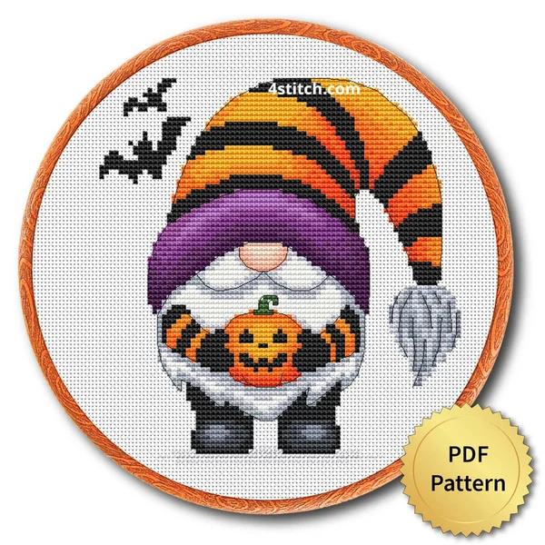 Pumpkin Basket Striped Hat Gnome displayed on white Aida in a wooden embroidery hoop with a PDF pattern badge