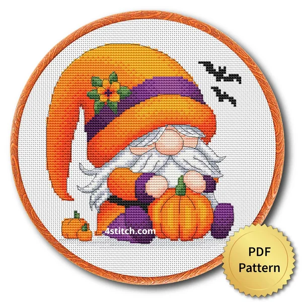 Pumpkin Flower Halloween Gnome displayed on white Aida in a wooden embroidery hoop with a PDF pattern badge
