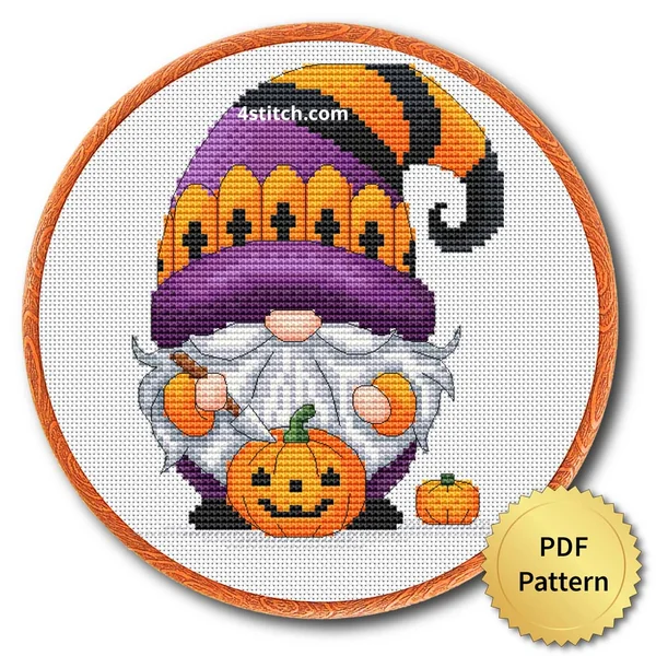 Jack-o'-Lantern Fence Hat Gnome displayed on white Aida in a wooden embroidery hoop with a PDF pattern badge