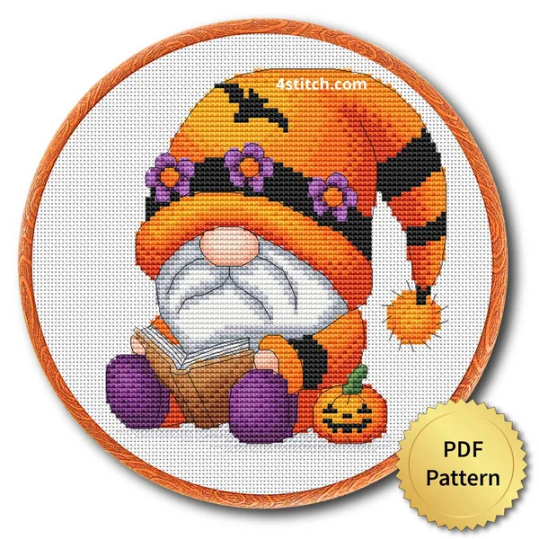 Pumpkin Flower Hat Gnome displayed on white Aida in a wooden embroidery hoop with a PDF pattern badge