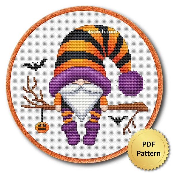 Pumpkin Charm Branch Halloween Gnome displayed on white Aida in a wooden embroidery hoop with a PDF pattern badge