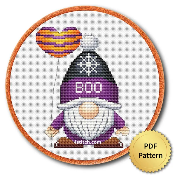 Boo Balloon Halloween Gnome displayed on white Aida in a wooden embroidery hoop with a PDF pattern badge