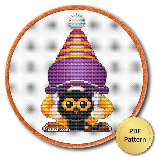 Black Cat Hug Halloween Gnome displayed on white Aida in a wooden embroidery hoop with a PDF pattern badge