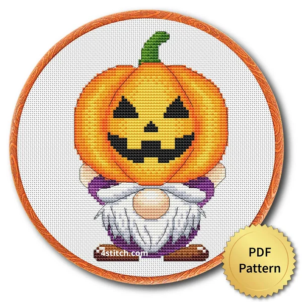 Pumpkin-Carrying Halloween Gnome displayed on white Aida in a wooden embroidery hoop with a PDF pattern badge