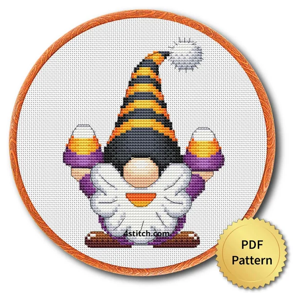 Candy Corn Halloween Gnome displayed on white Aida in a wooden embroidery hoop with a PDF pattern badge