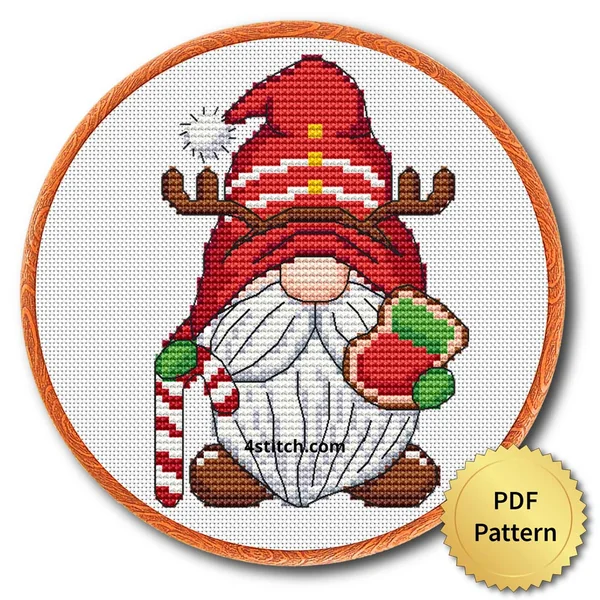 Finished reindeer hat christmas gnome cross stitch design in a wooden embroidery hoop
