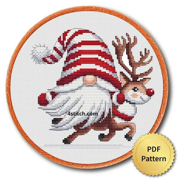 Gnome Riding Reindeer Cross Stitch Pattern shown as finished cross stitch in an embroidery hoop with a gold PDF Pattern medal.