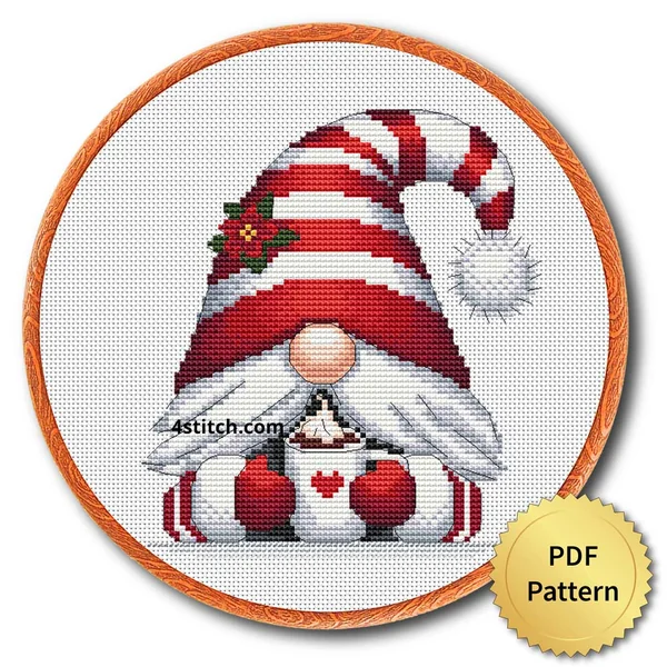 Heart Mug Christmas Gnome Cross Stitch Pattern shown as finished cross stitch in an embroidery hoop with a gold PDF Pattern medal.