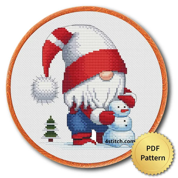 Snowman Christmas Gnome Cross Stitch Pattern shown as finished cross stitch in an embroidery hoop with a gold PDF Pattern medal.