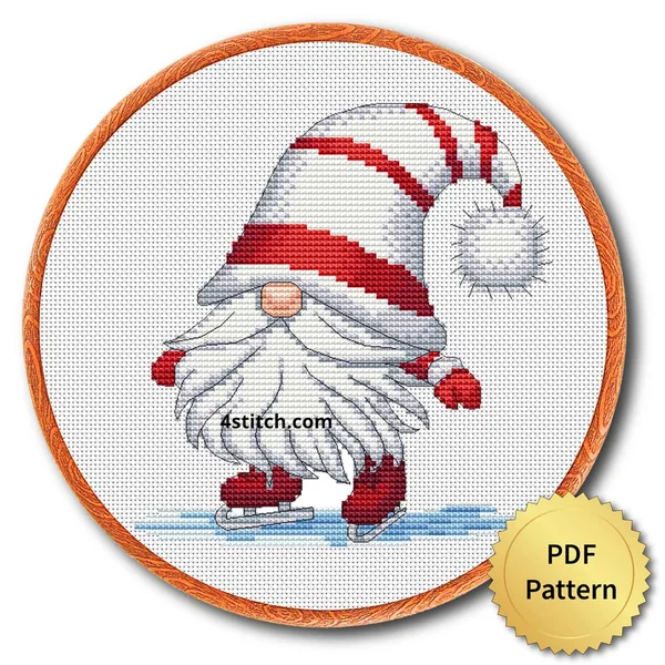 Ice Skating Christmas Gnome Cross Stitch Pattern shown as finished cross stitch in an embroidery hoop with a gold PDF Pattern medal.