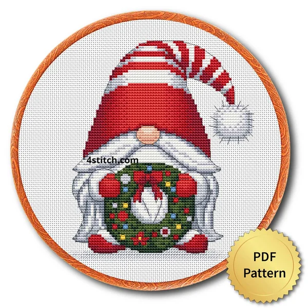 Bauble Wreath Christmas Gnome Cross Stitch Pattern shown as finished cross stitch in an embroidery hoop with a gold PDF Pattern medal.