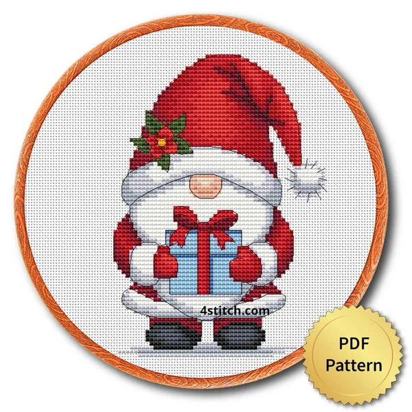 Christmas Present Gnome cross stitch design in an embroidery hoop with a PDF Pattern medal