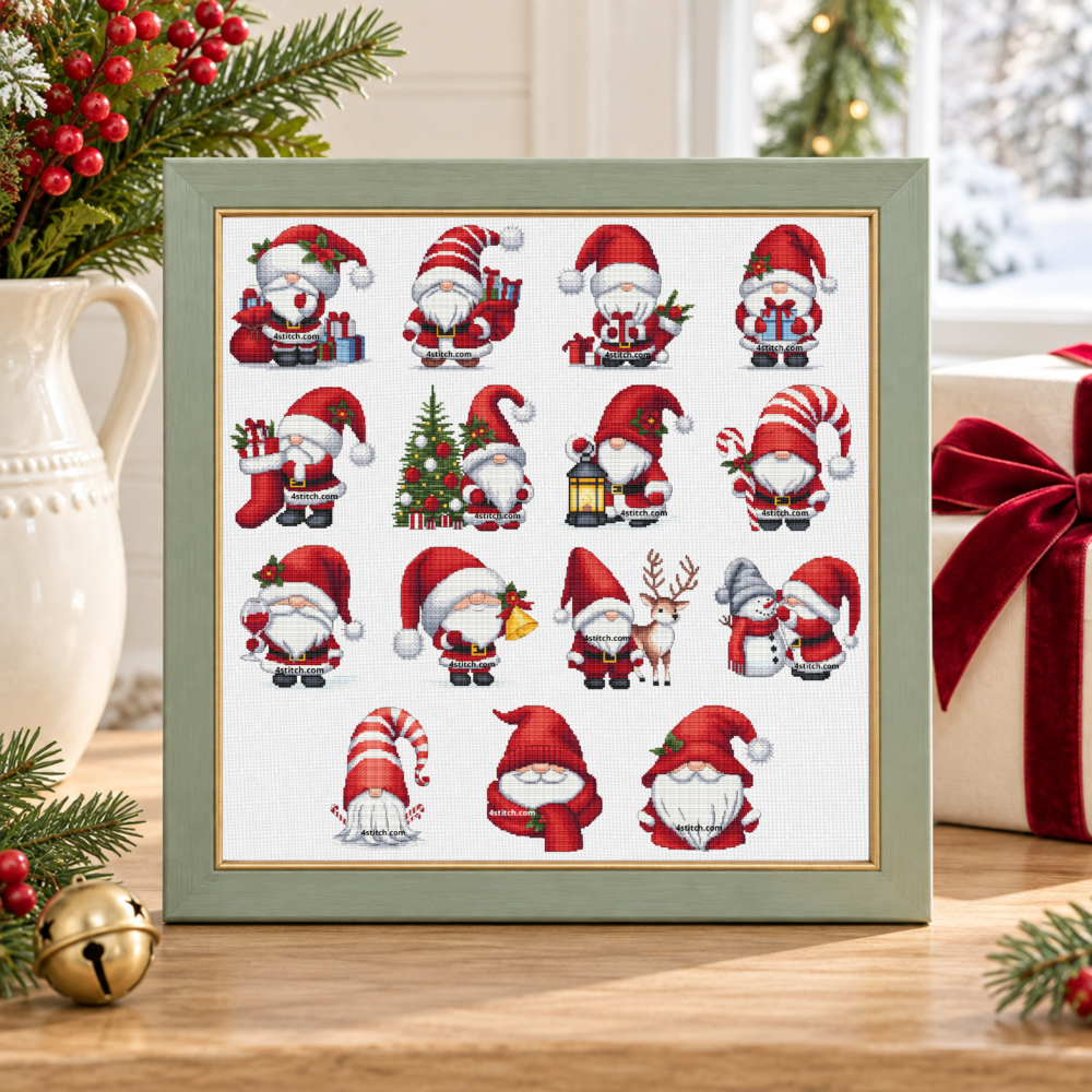 All 15 Santa gnome cross stitch designs from Series 2 on white Aida in a sage-green frame in a bright Christmas tabletop setting.