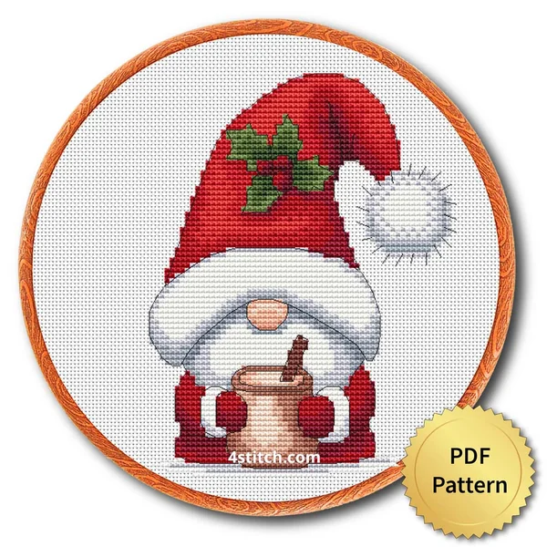 Hot Cocoa Santa Gnome cross stitch design in an embroidery hoop with a PDF Pattern medal