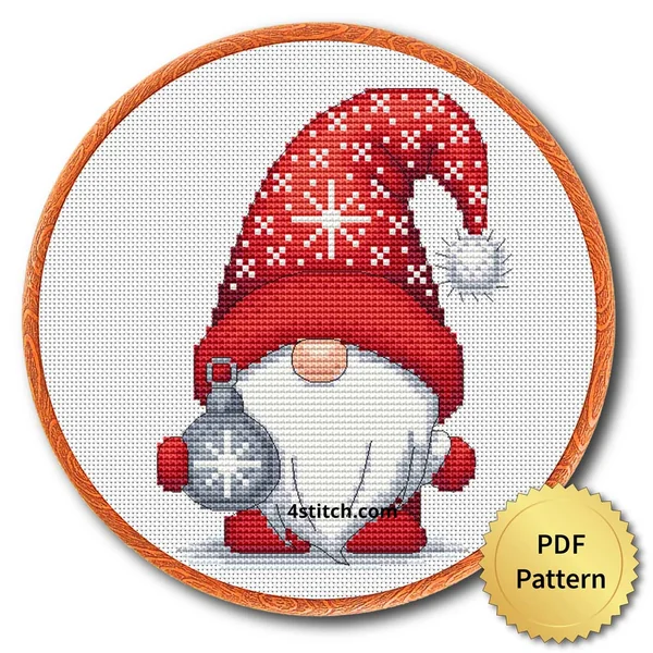 Silver Snowflake Bauble Gnome cross stitch design in an embroidery hoop with a PDF Pattern medal