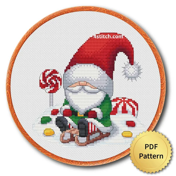 Gingerbread Sleigh Christmas Gnome cross stitch design in an embroidery hoop with a PDF Pattern medal