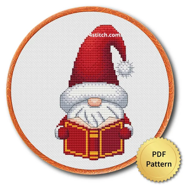 Christmas Book Santa Gnome cross stitch design in an embroidery hoop with a PDF Pattern medal