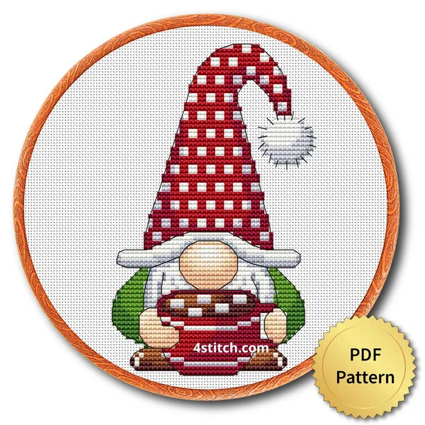 Hot Cocoa Christmas Gnome Cross Stitch Pattern shown in an embroidery hoop with a gold PDF Pattern medal