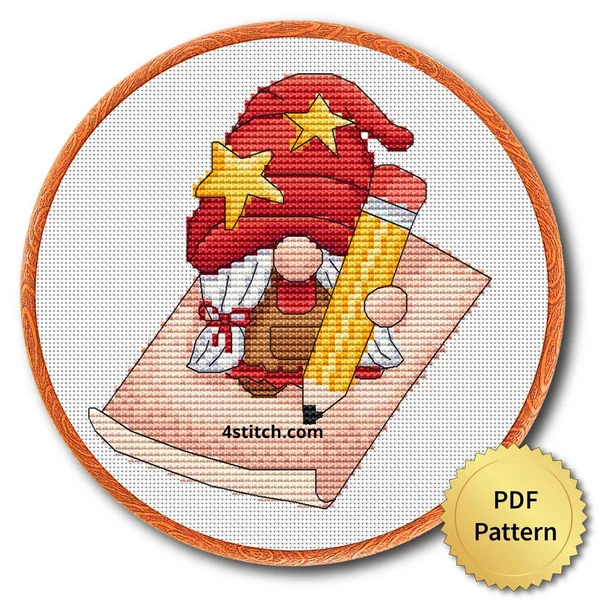 Finished letter writing christmas gnome cross stitch design in a wooden embroidery hoop