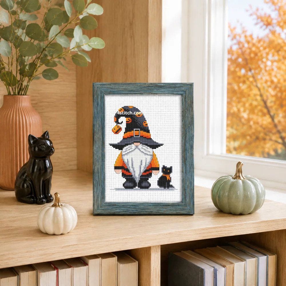 Small framed Pumpkin Charm Witch Gnome stitched on white Aida in a bright themed interior; complete original motif and 4stitch.com watermark.