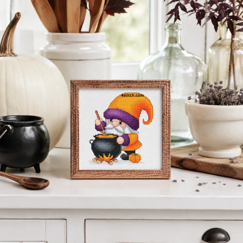 Small framed Cauldron Potion Halloween Gnome on white Aida in a bright themed interior, with the complete original motif and its 4stitch.com watermark.