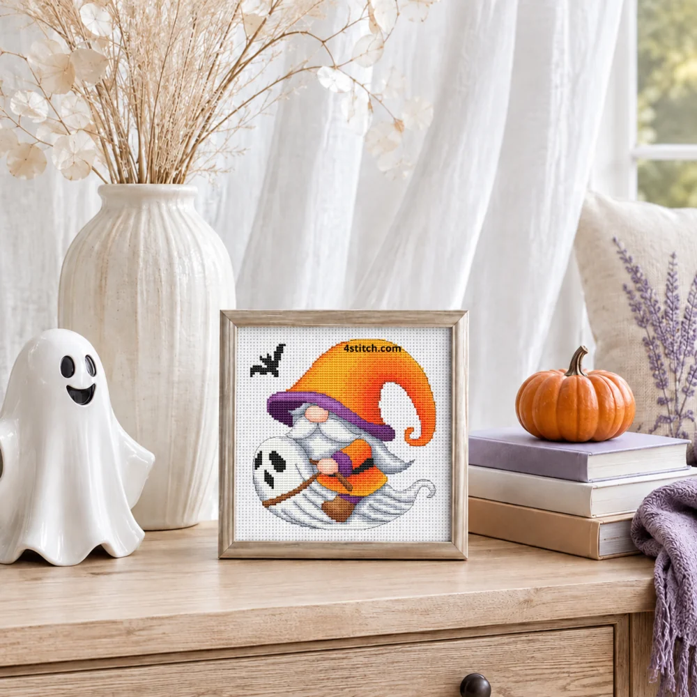 Small framed Flying Ghost Halloween Gnome on white Aida in a bright themed interior, with the complete original motif and its 4stitch.com watermark.