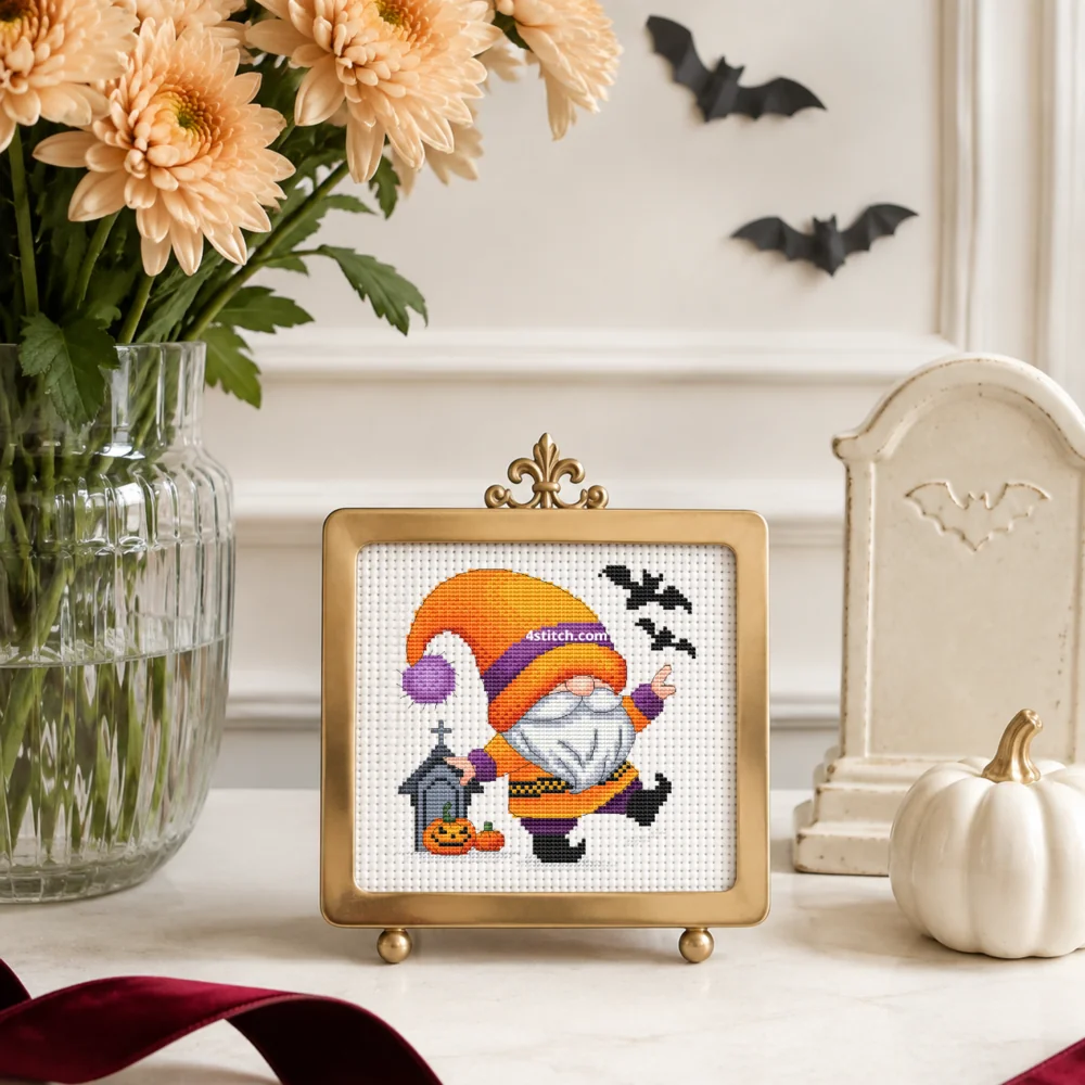Small framed Dancing Graveyard Halloween Gnome on white Aida in a bright themed interior, with the complete original motif and its 4stitch.com watermark.