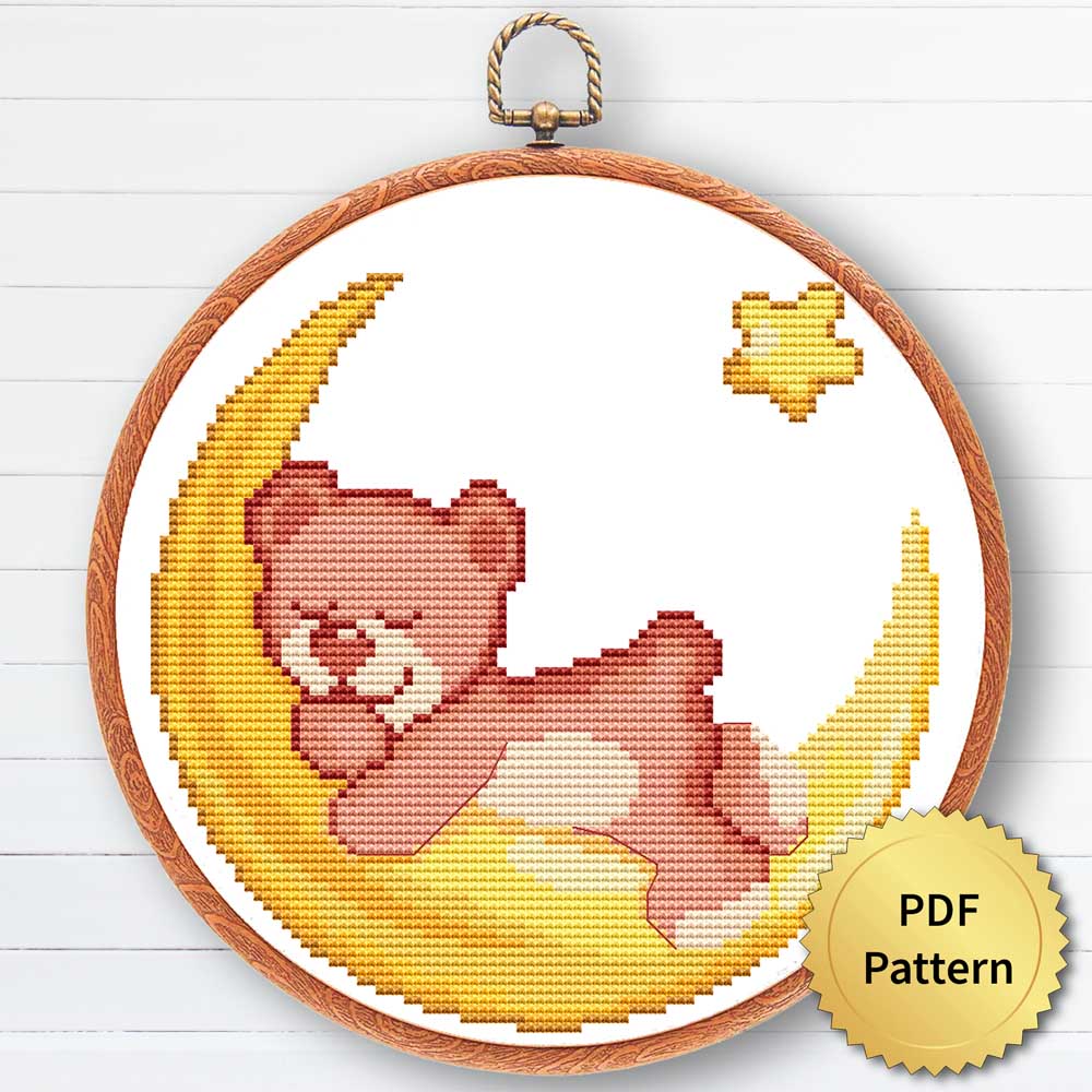 A cross stitch pattern featuring a cute Pull Bear on The Moon