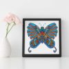 A cross stitch pattern featuring a beautiful mandala butterfly