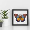 A cross stitch pattern featuring a beautiful mandala butterfly