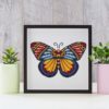 A cross stitch pattern featuring a beautiful mandala butterfly