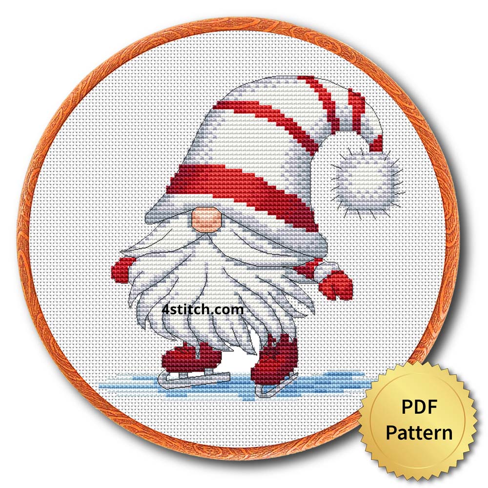 Ice Skating Christmas Gnome Cross Stitch Pattern shown as finished cross stitch in an embroidery hoop with a gold PDF Pattern medal.