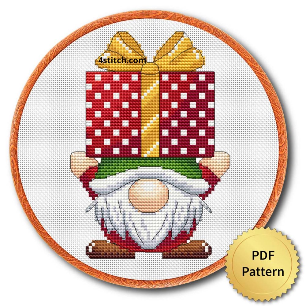 Gift Box Hat Christmas Gnome Cross Stitch Pattern shown in an embroidery hoop with a gold PDF Pattern medal