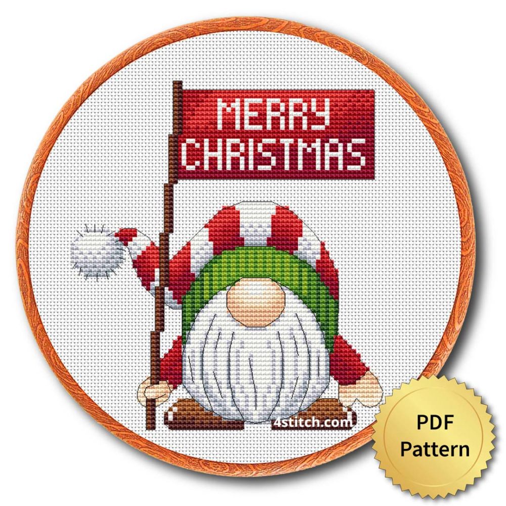 Merry Christmas Sign Gnome Cross Stitch Pattern shown in an embroidery hoop with a gold PDF Pattern medal