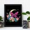 Butterfly cross stitch pattern on black canvas, cottagecore style