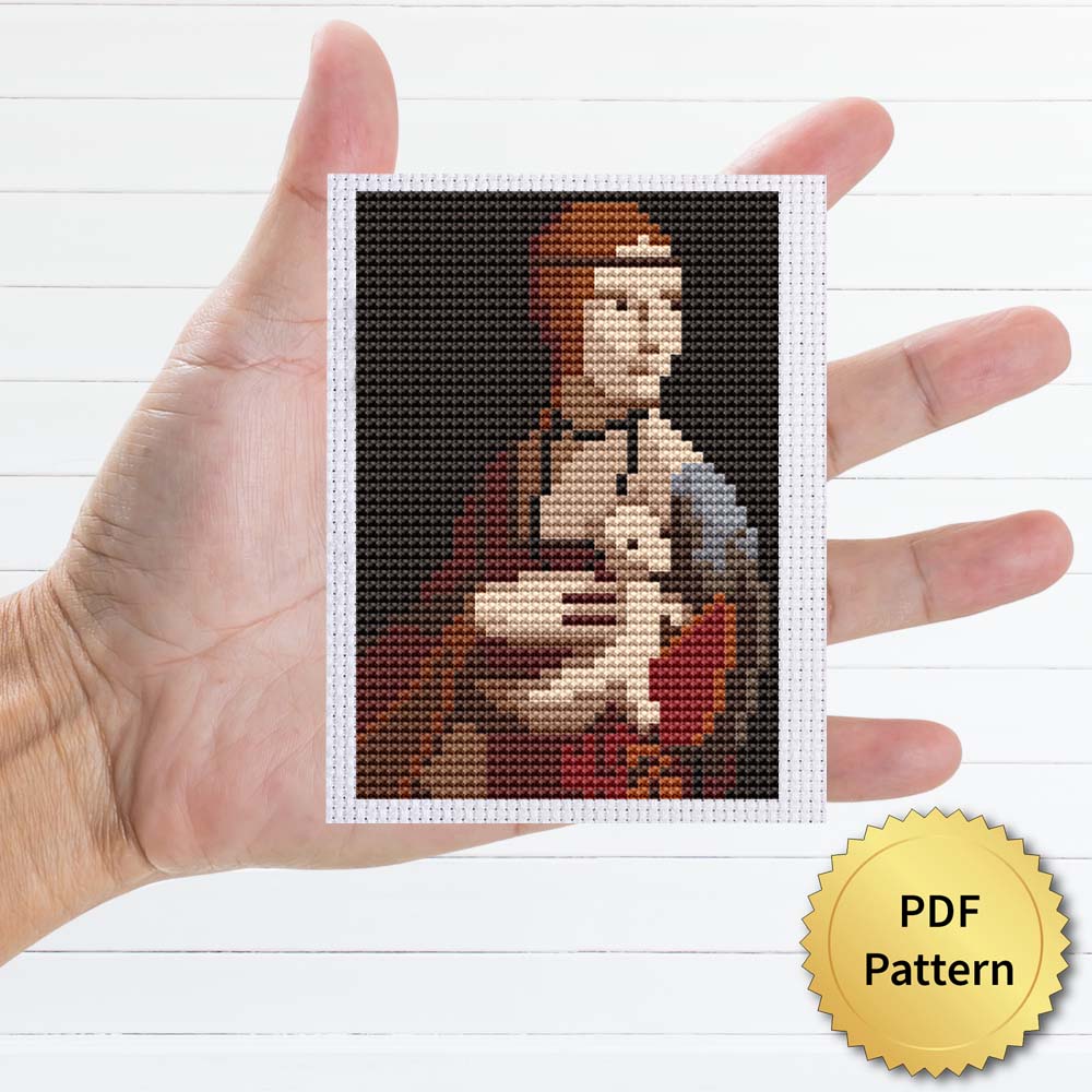 The Lady with an Ermine cross stitch pattern featuring a beautiful reproduction of the famous Leonardo Da Vinci painting