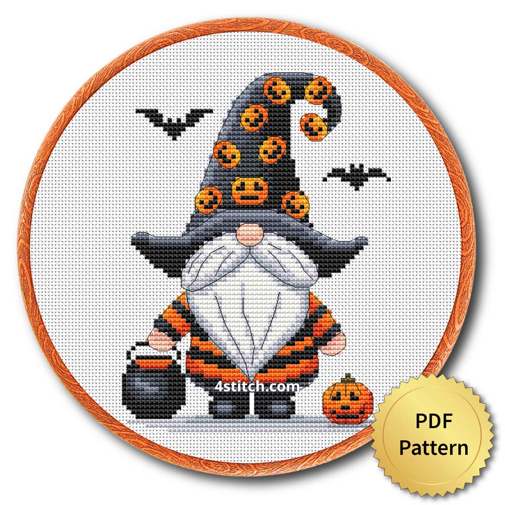 Pumpkin Hat Halloween Gnome displayed on white Aida in a wooden embroidery hoop with a PDF pattern badge