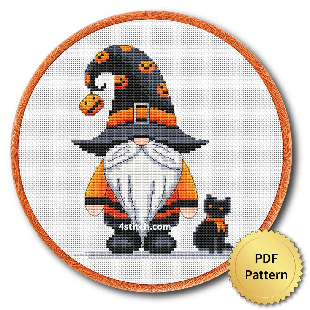 Pumpkin Charm Witch Gnome displayed on white Aida in a wooden embroidery hoop with a PDF pattern badge