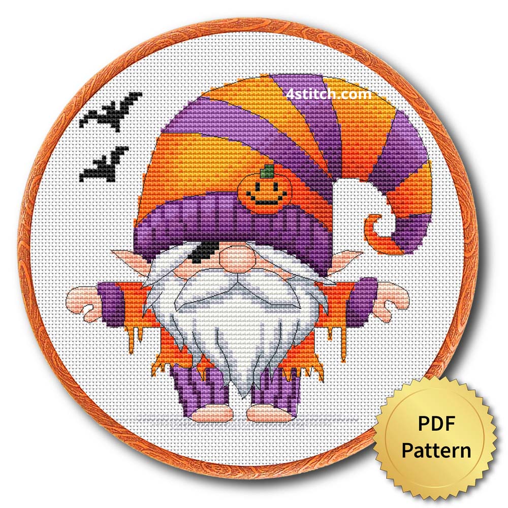 Striped Hat Halloween Gnome displayed on white Aida in a wooden embroidery hoop with a PDF pattern badge