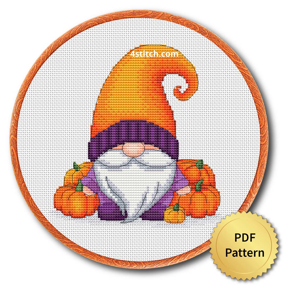 Pumpkin Patch Orange Hat Gnome displayed on white Aida in a wooden embroidery hoop with a PDF pattern badge