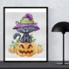 Halloween Cat Cross Stitch Pattern - Image of a finished cross stitch project with a black cat wearing a witch hat.