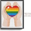 LGBT Pride Cross Stitch Pattern - Image of a finished cross stitch project with the words "Love is Love" in rainbow colors.