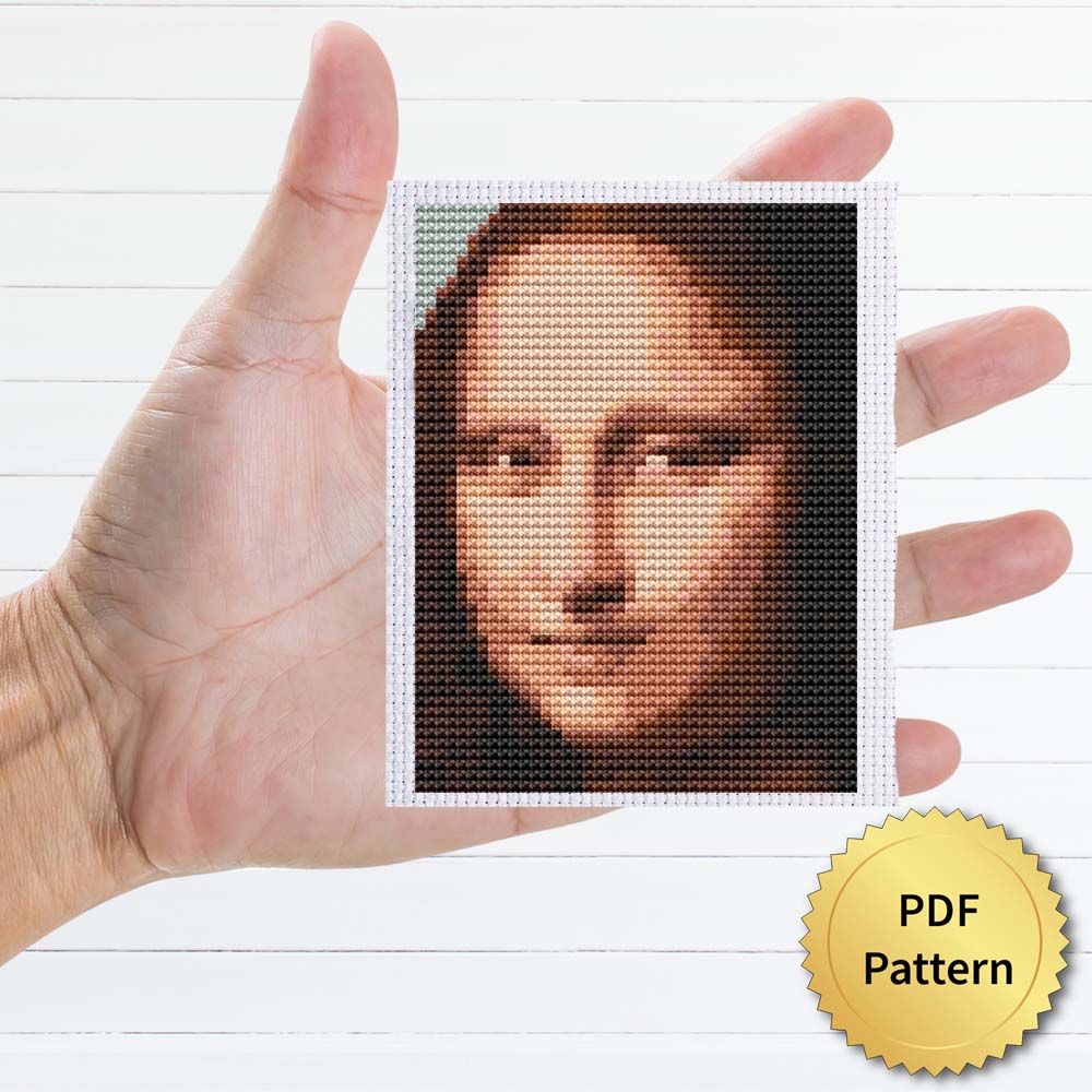 Mona Lisa cross stitch pattern featuring a beautiful reproduction of the famous Leonardo Da Vinci painting