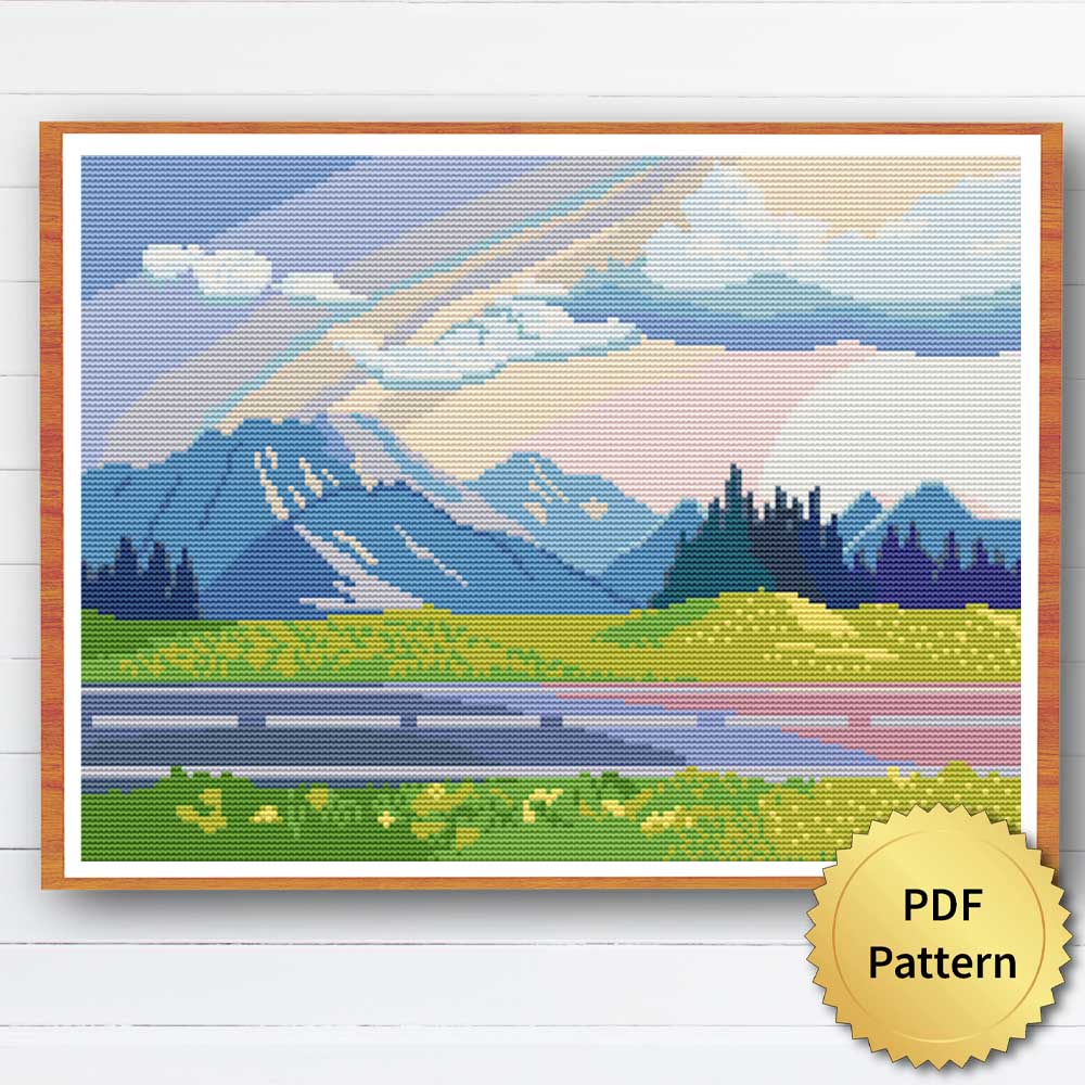 Mountain Road Cross Stitch Pattern showing a scenic view of a winding road surrounded by mountains and trees.