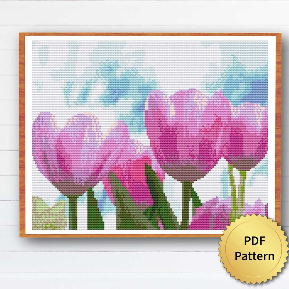 Tulip Cross Stitch Pattern - Image of a finished cross stitch project with a colorful tulip design.